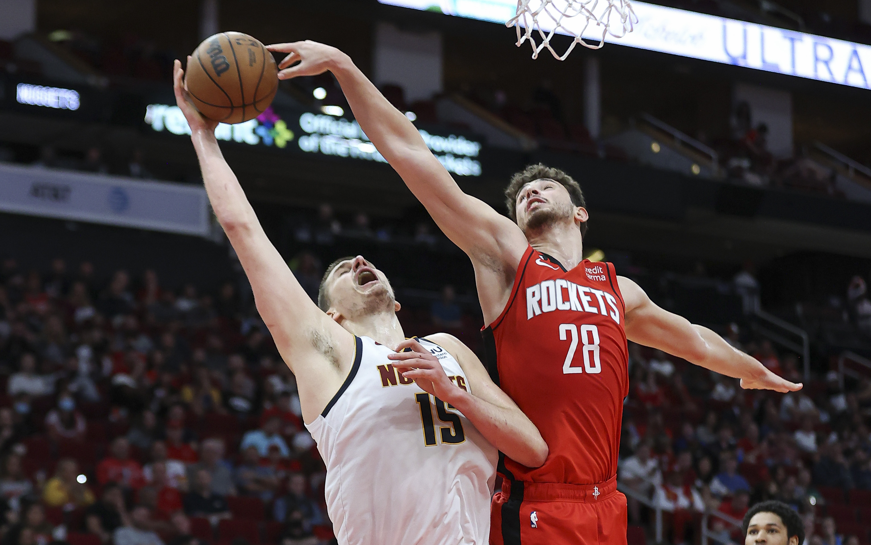Troy Taormina-USA TODAY Sports, Nuggets center Nikola Jokic (15) attempts to score as Houston Rockets center Alperen Sengun (28) defends.